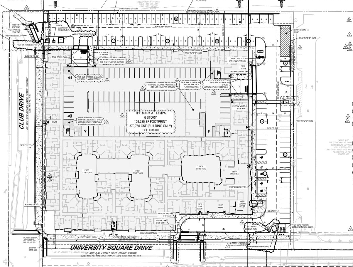 Site plan of the development, featuring proposed parking and interior spaces.
