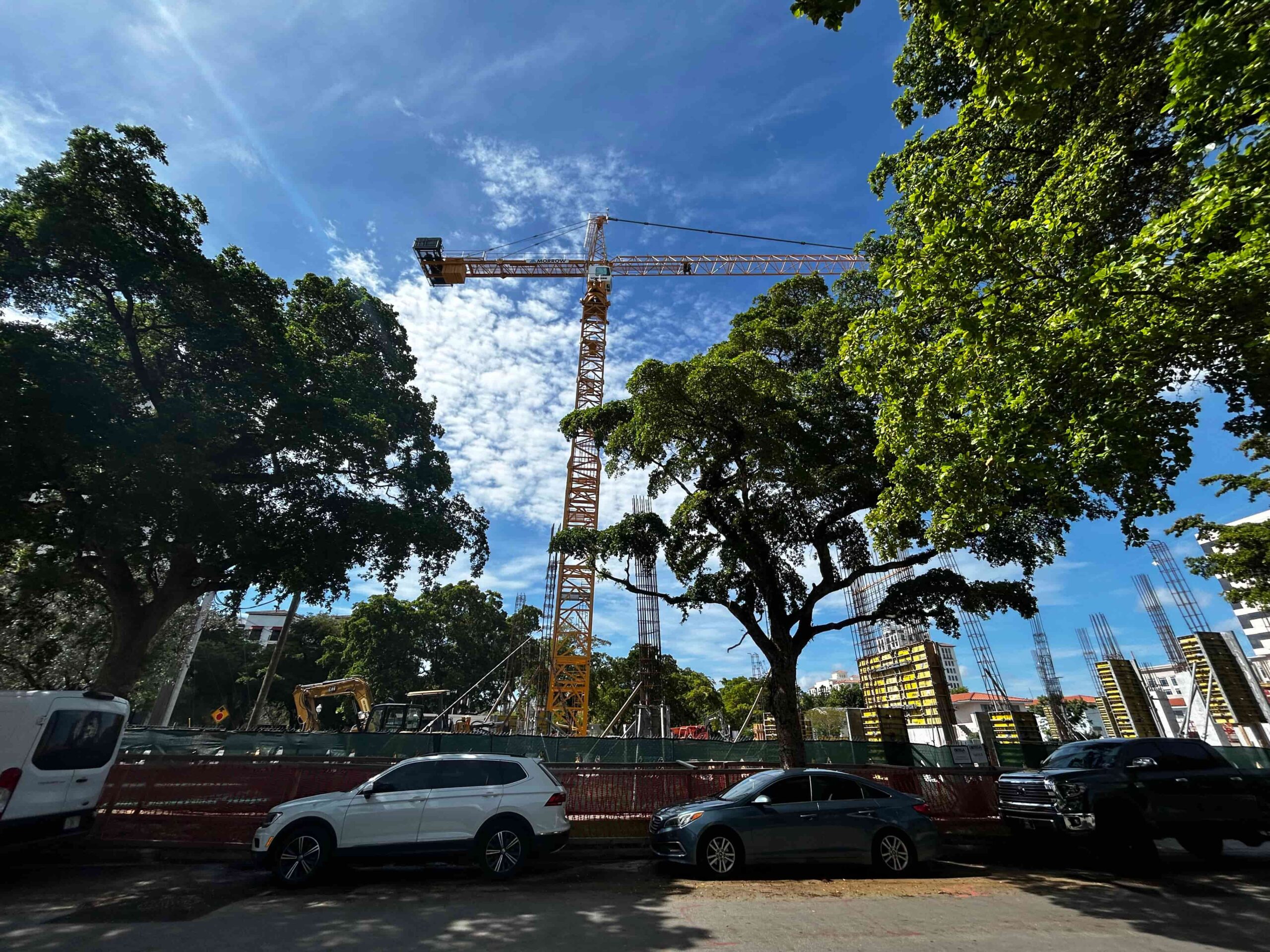 A yellow crane has been erected on-site.